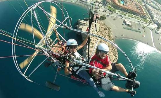 photo flying in tandem paramotor with monitor